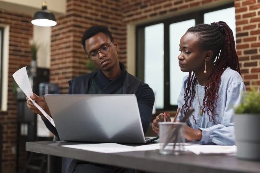 Tax professionals reviewing accounts together